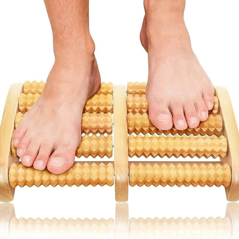 Wooden foot roller massager with feet on a white background