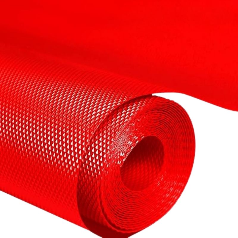 Roll of red textured material on a white background