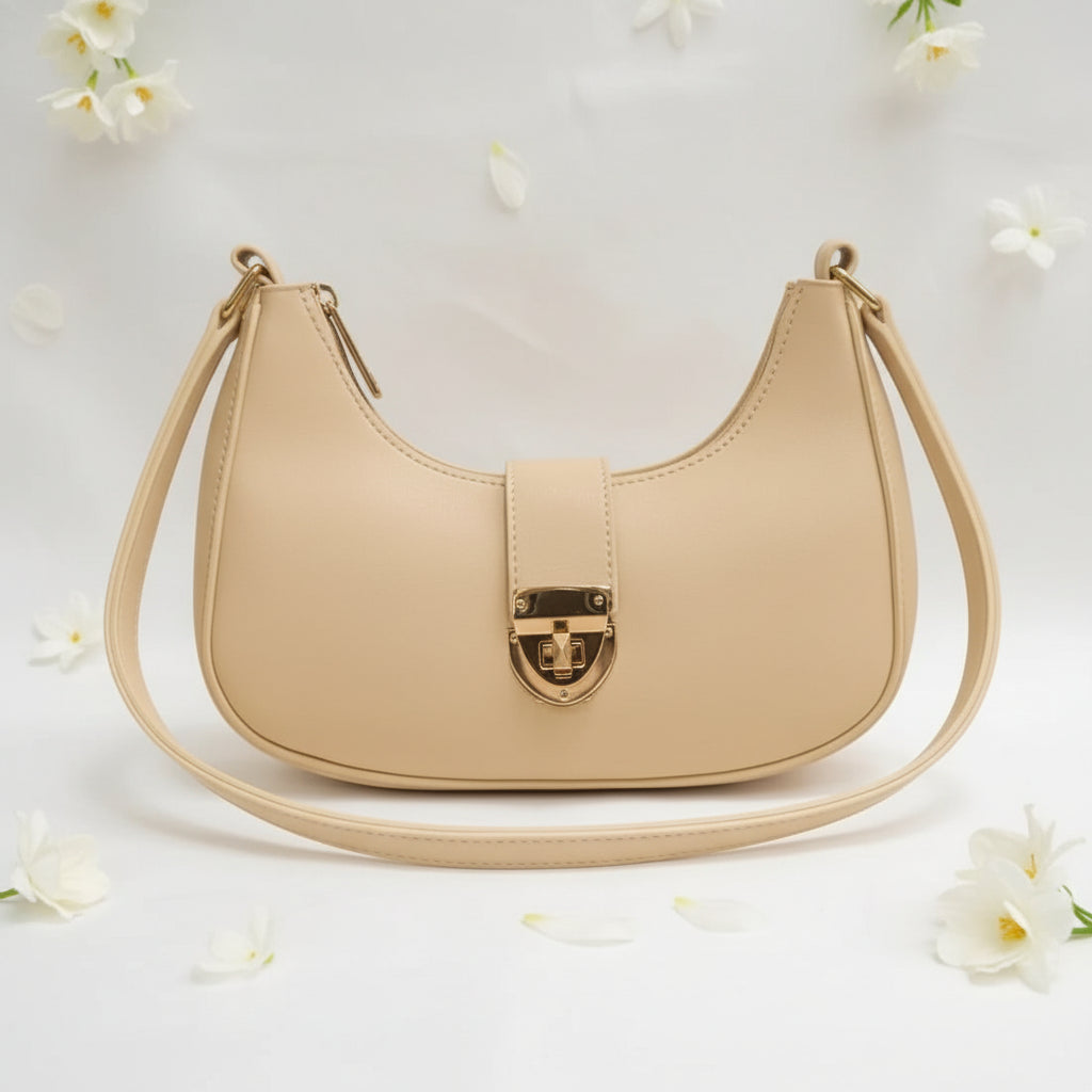 Skin Color handbag with a gold clasp on a white background