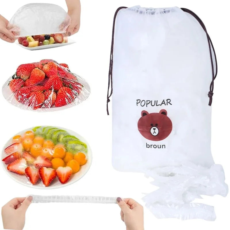 A white drawstring storage bag with a teddy bear face and the text 'POPULAR broun' on the front, shown alongside fruit covered with clear plastic wrap and hands stretching a clear cover. The bag appears to be the product being sold, with the inset photos demonstrating its use.