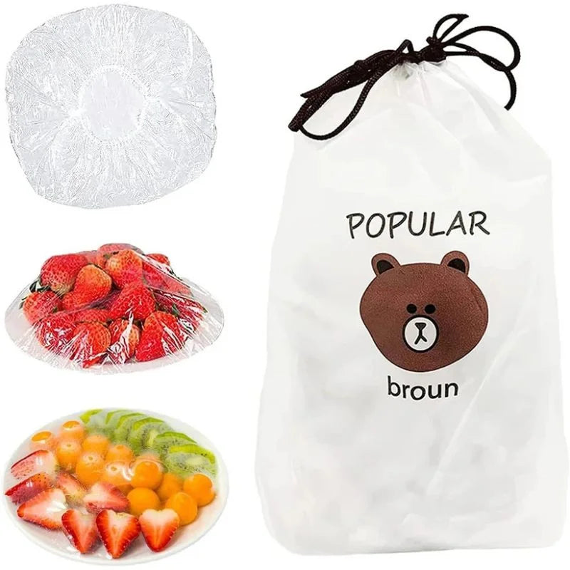 White drawstring bag with a bear design labeled 'Popular broun', surrounded by fruits and a white ball.