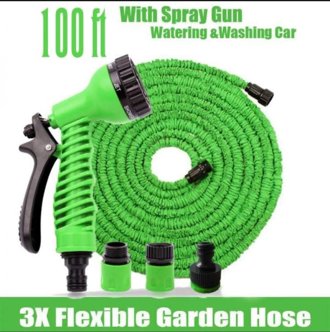 Hunt PK Green flexible garden hose with spray gun on a white background