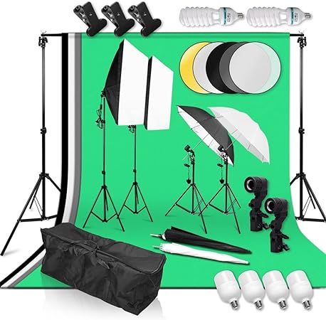 Photography studio equipment set with lights, stands, and backdrop on a white background