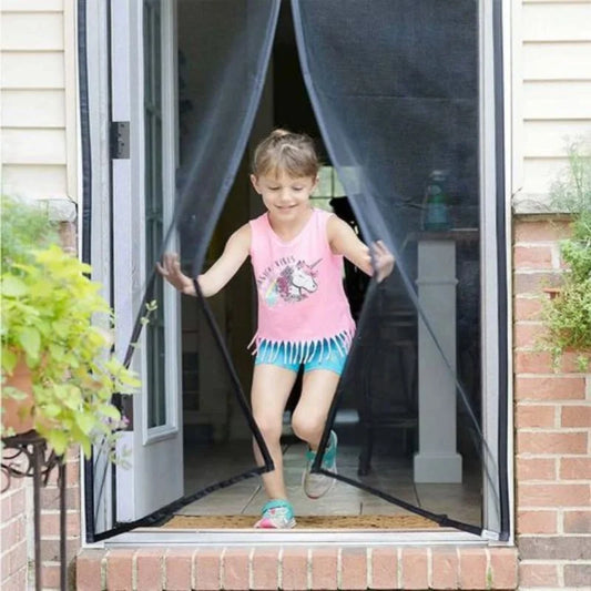 hunt pk Child playing through a screen door with a clear curtain