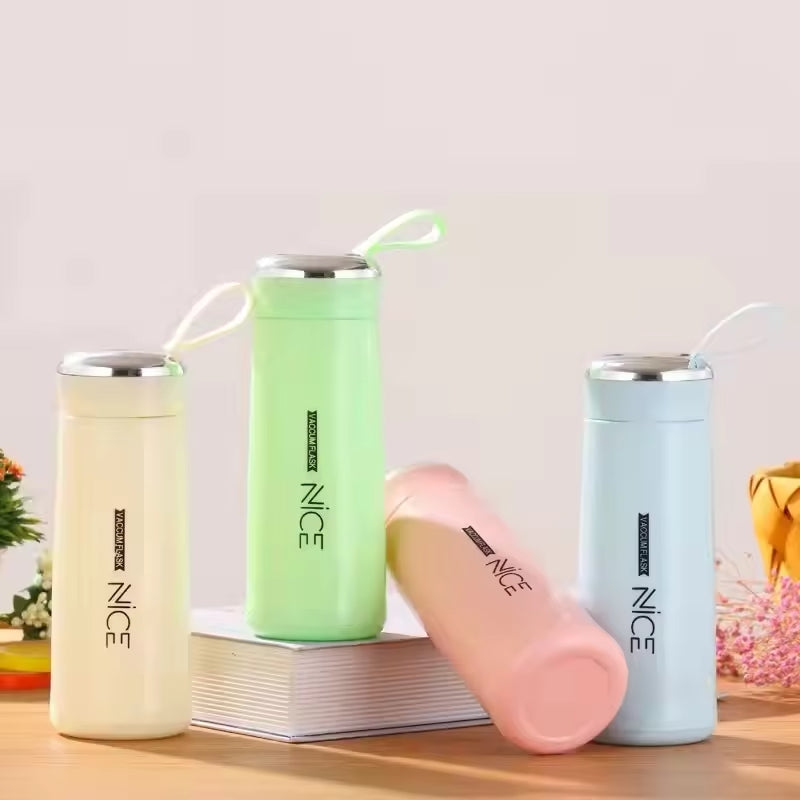 Hunt PK Four colorful insulated cups with 'NICE' branding on a wooden surface.